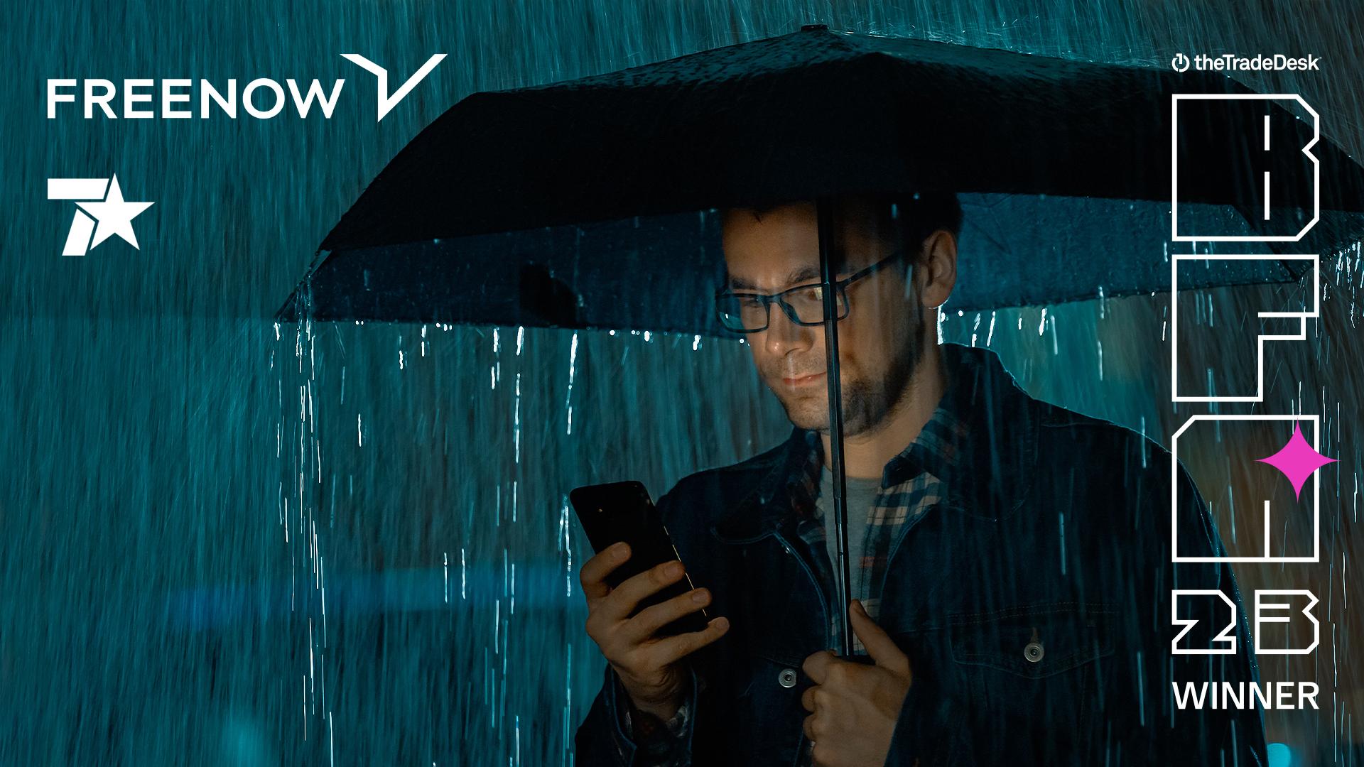Image of a man holding an umbrella in the rain with text "FREENOW Case Study with The Trade Desk - BFA '23 Winner"