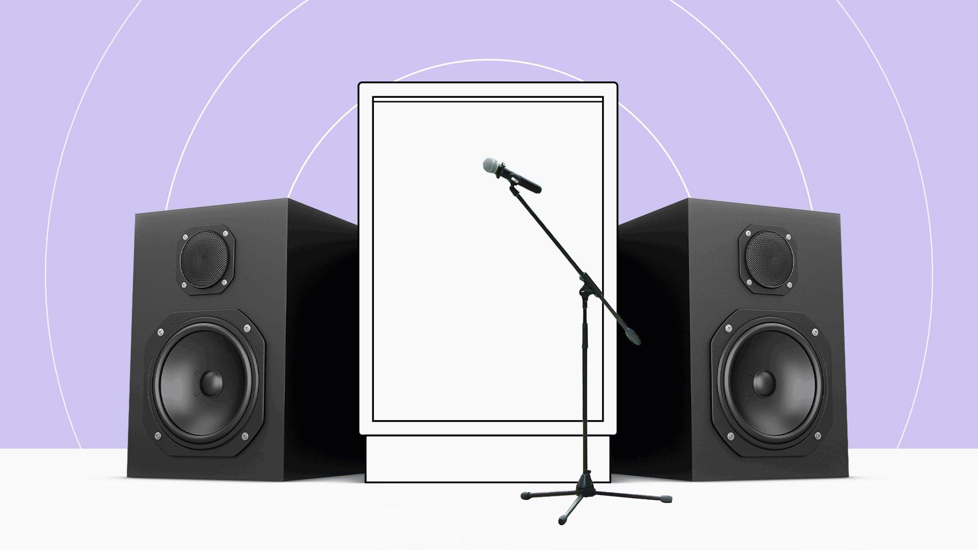 A tall digital screen with a microphone in front if it sits between two tall speaker boxes.
