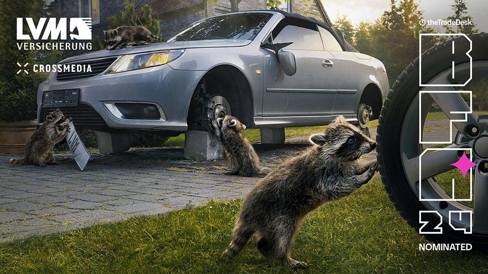 Image shows three raccoons fixing a car tire