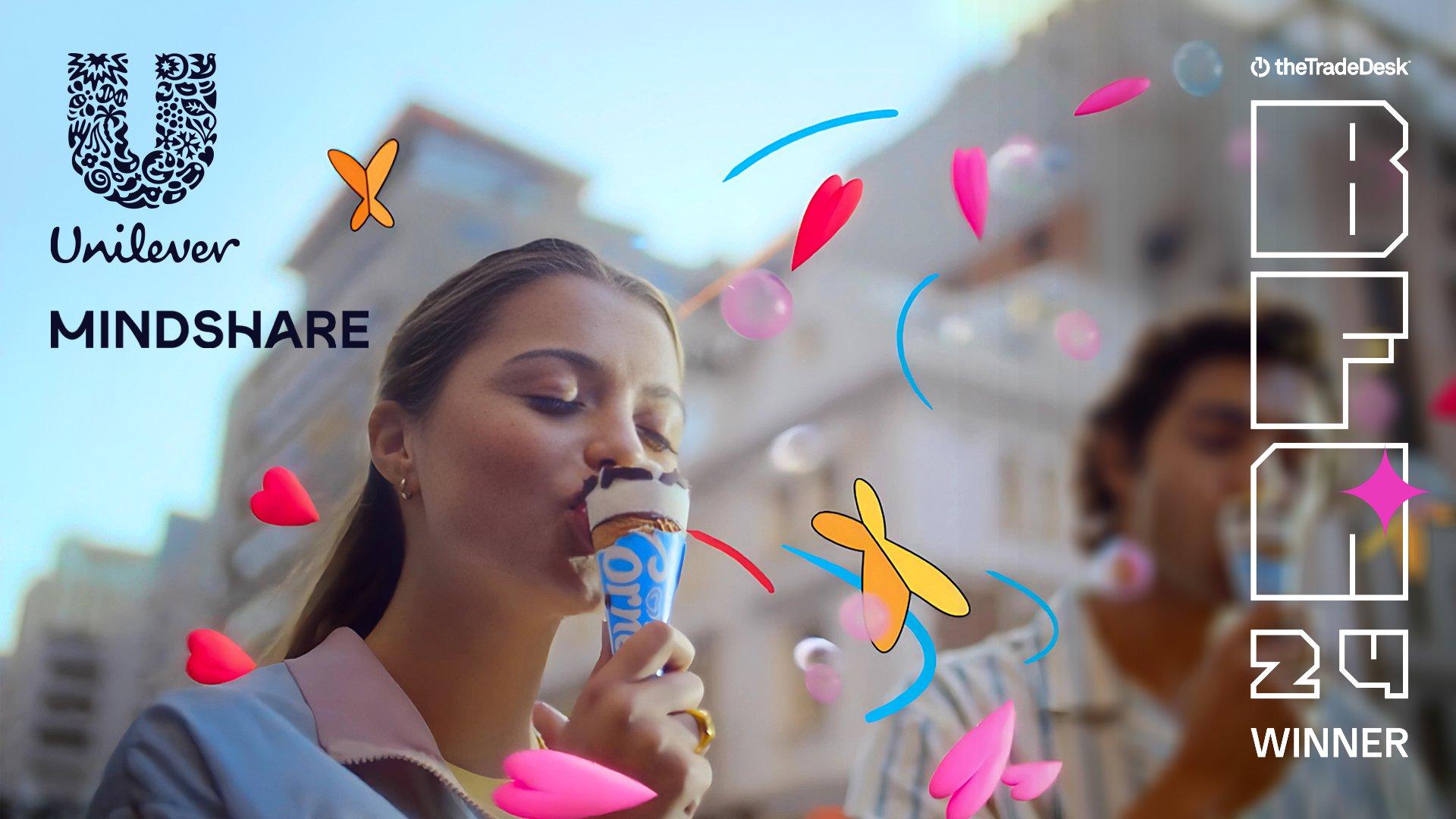 Unilever | Mindshare - BFA '24 Winner - Couple eating ice cream with graphics of hearts and butterflies floating around them