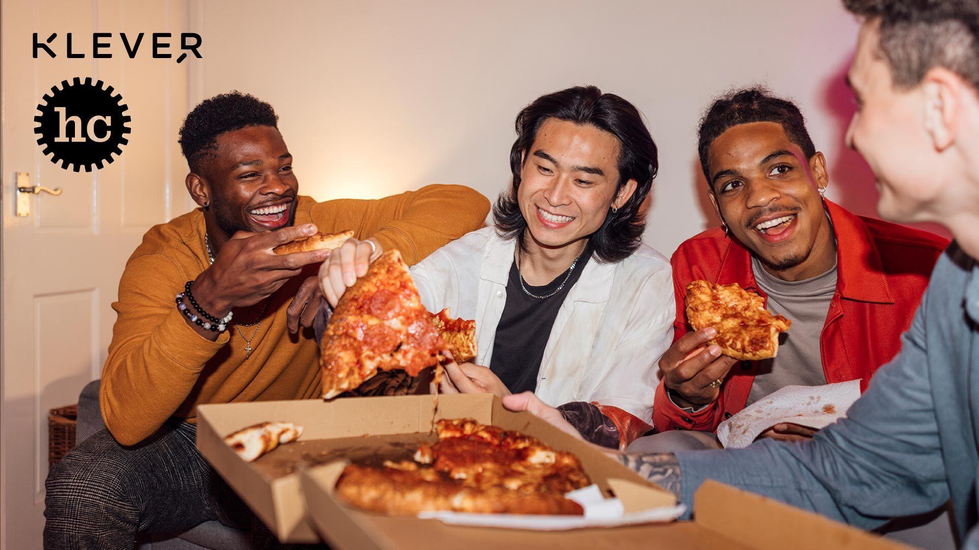 A group of friends laugh and eat pizza together. Klever and Happy Cog logos are shown at the top left of the image.