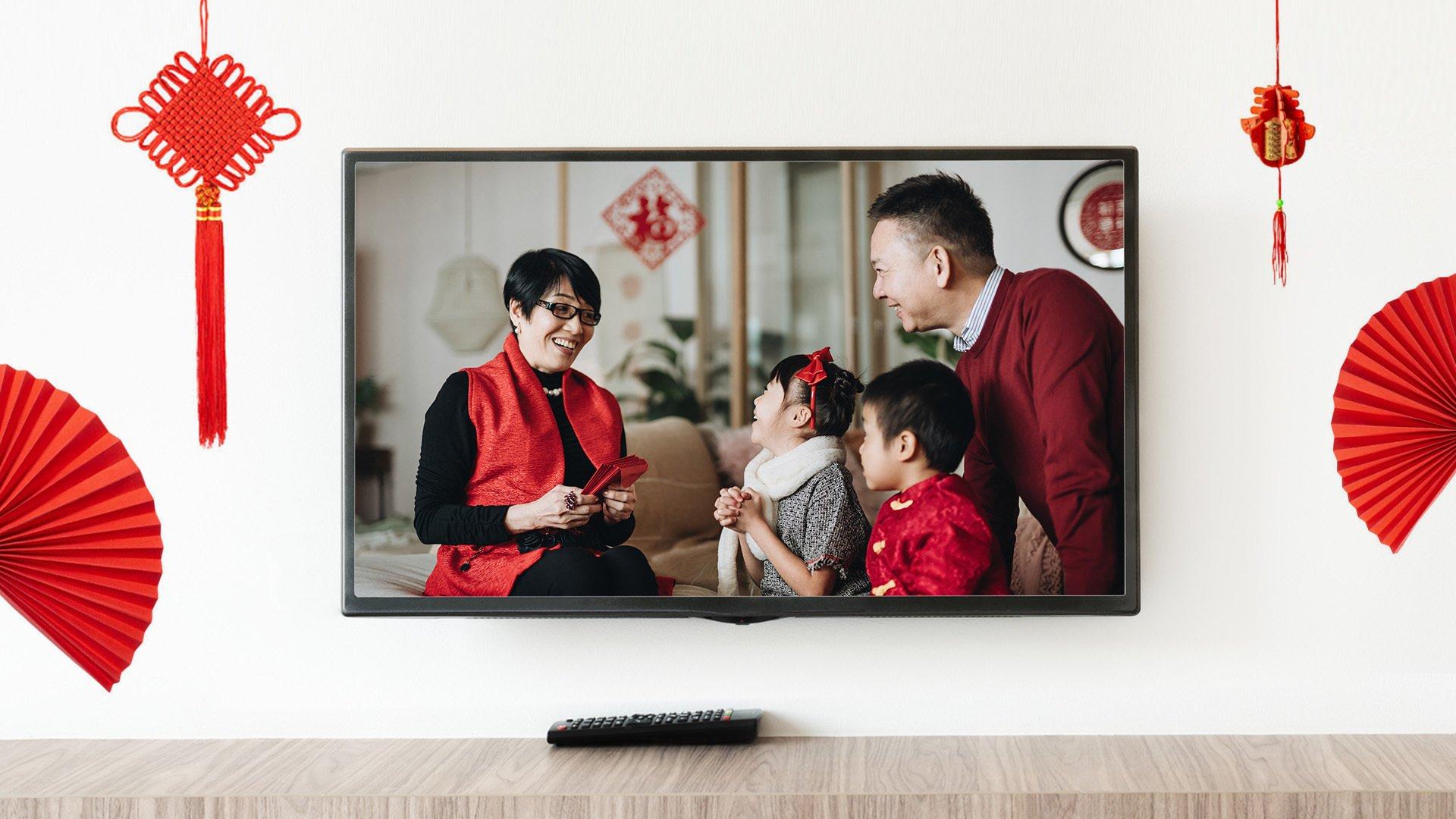 Image of a family inside of a TV, celebrating Lunar New Year